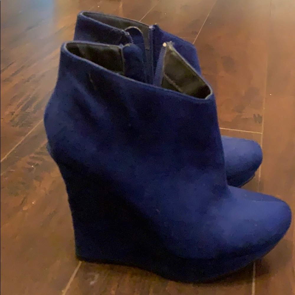 Midnight blue Michael Antonio wedge heel booties.